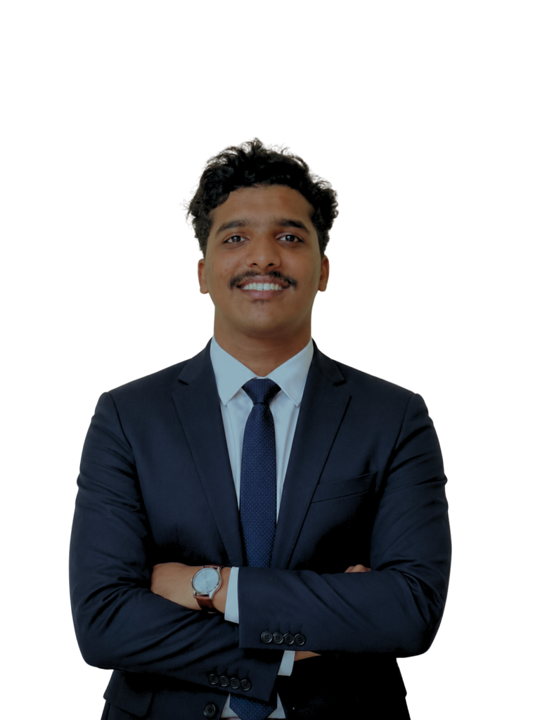 "Best digital marketing in Thrissur – Professional portrait of a digital marketing specialist in a navy blue suit, smiling confidently with folded arms against a clean beige background, showcasing expertise in SEO, SEM, SMM, content marketing, and web development.""Best digital marketing in Thrissur – Professional portrait of a digital marketing specialist in a navy blue suit, smiling confidently with folded arms against a clean beige background, showcasing expertise in SEO, SEM, SMM, content marketing, and web development."